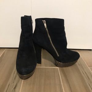 Suede heels with a silver trim bottom